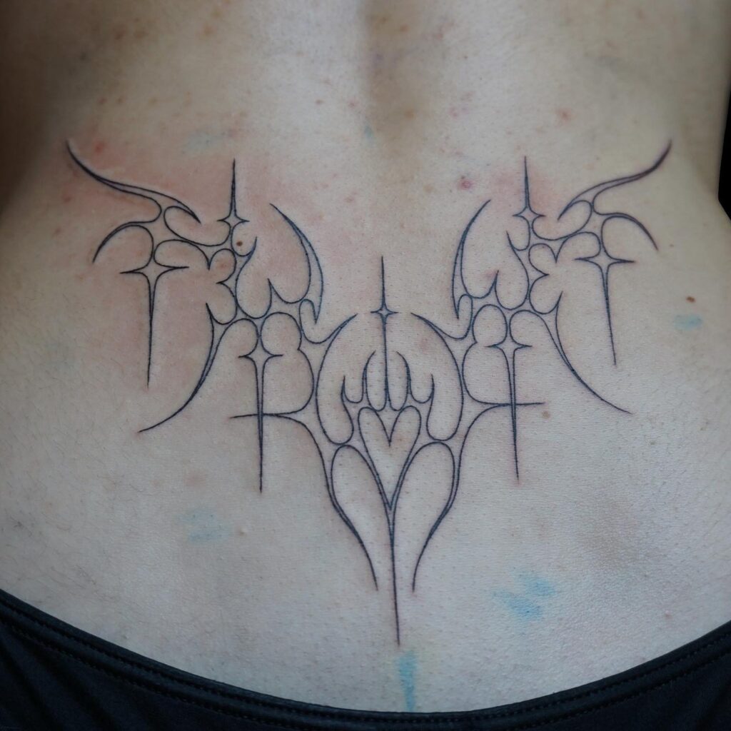 Fine Line Tribal Heart Lower Back Tattoo