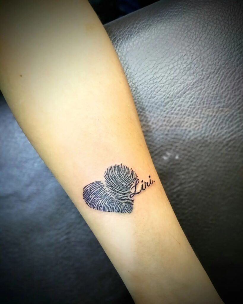 Matching Fingerprint Heart Tattoos with Roman Numerals fingerprint tattoos tattoo