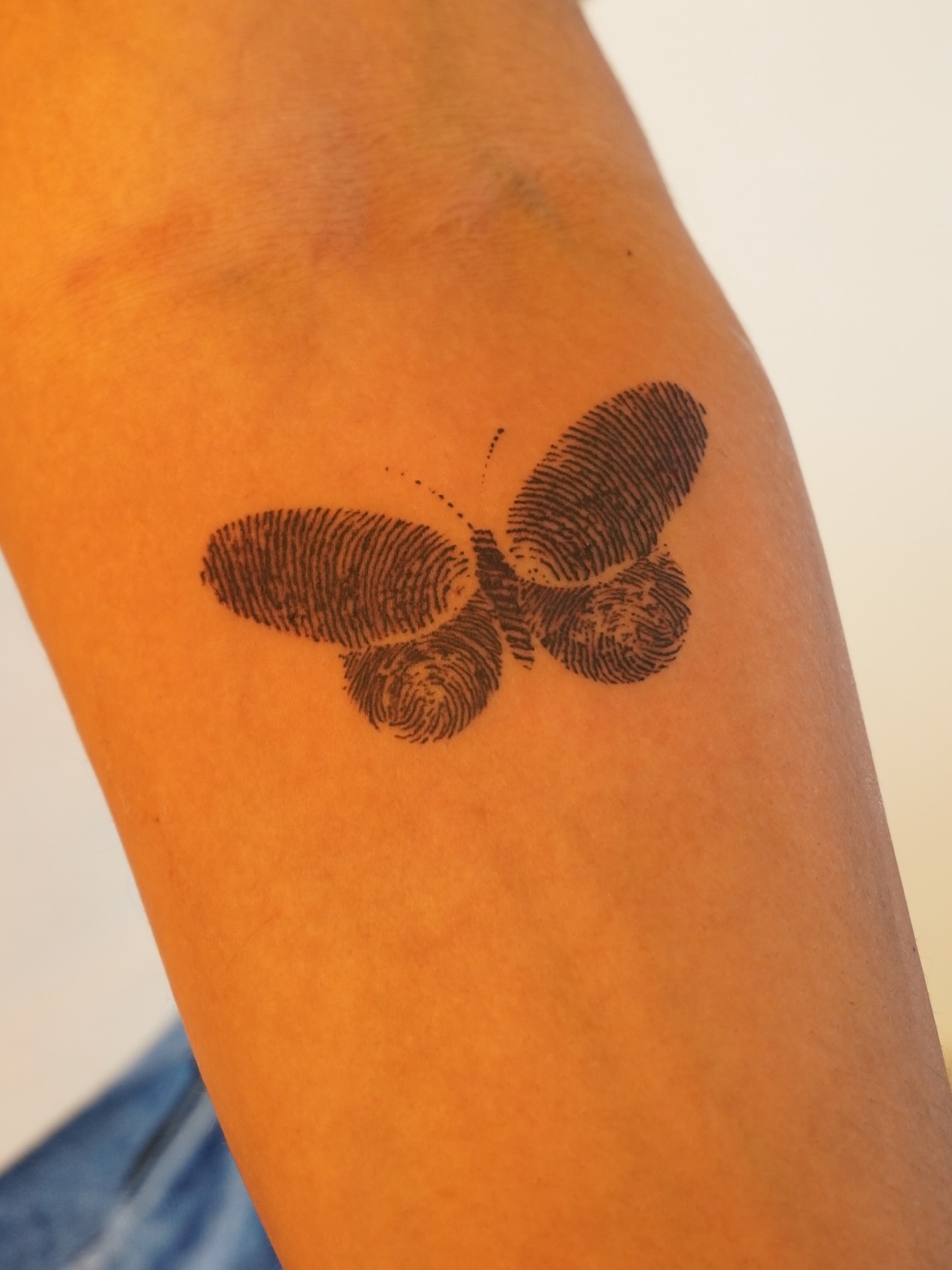 Fingerprint Butterfly Wings Tattoo