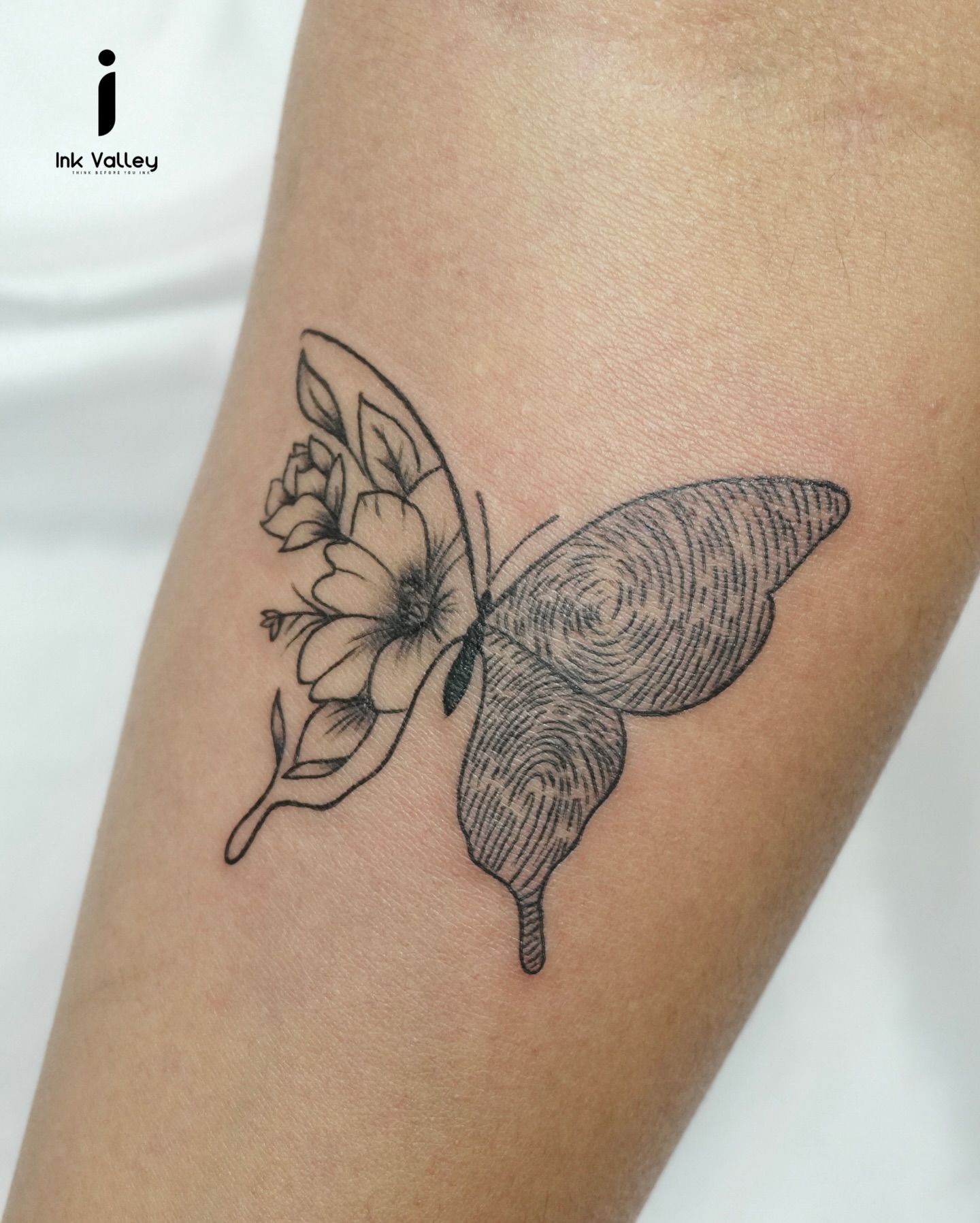 Floral Fingerprint Butterfly Tattoo