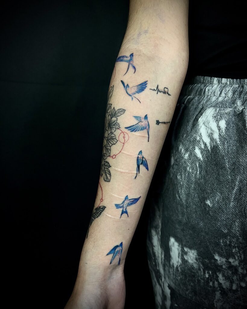 Flight of Healing Birds Forearm Tattoo bird tattoo ideas for women with meaning tattoo