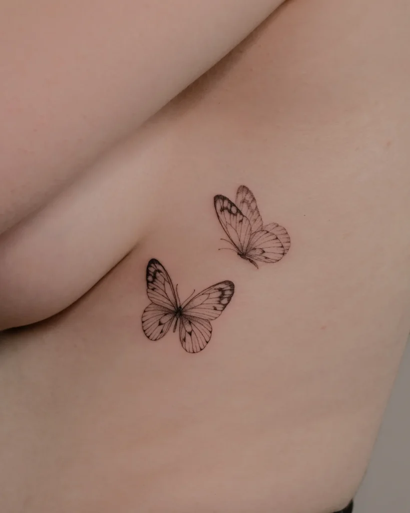 Small fine line butterflies on the rib