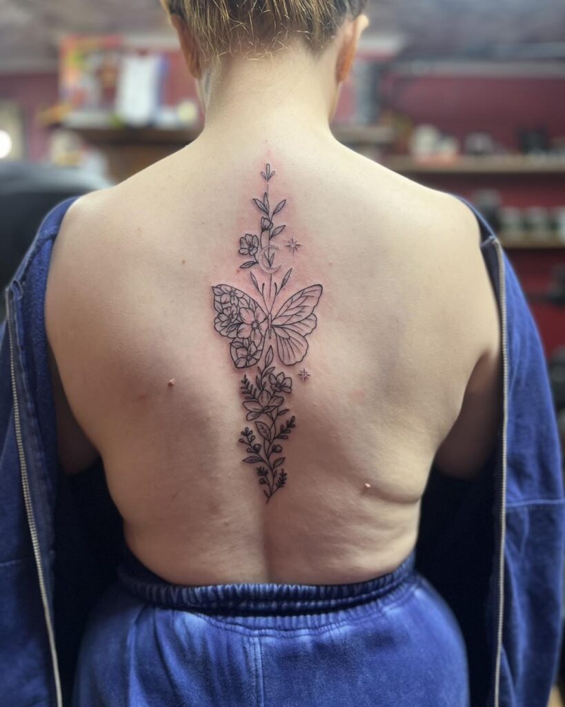 Ornamental Lotus Spine Tattoo