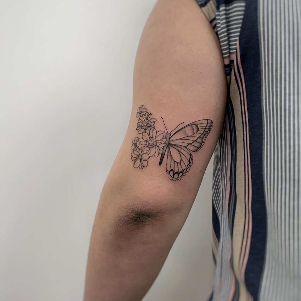 Floral Butterfly Upper Arm Tattoo half butterfly half flower tattoos tattoo