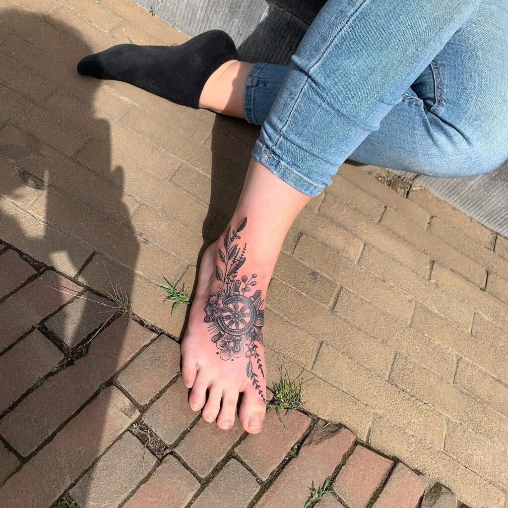 Ornamental Dotwork And Leaf Motif Foot Tattoo