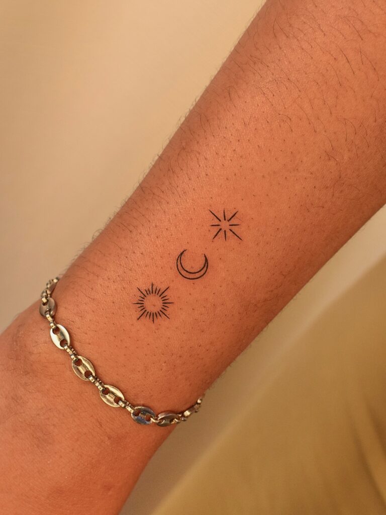 Floral Crescent Moon on Upper Back fine line tattoo