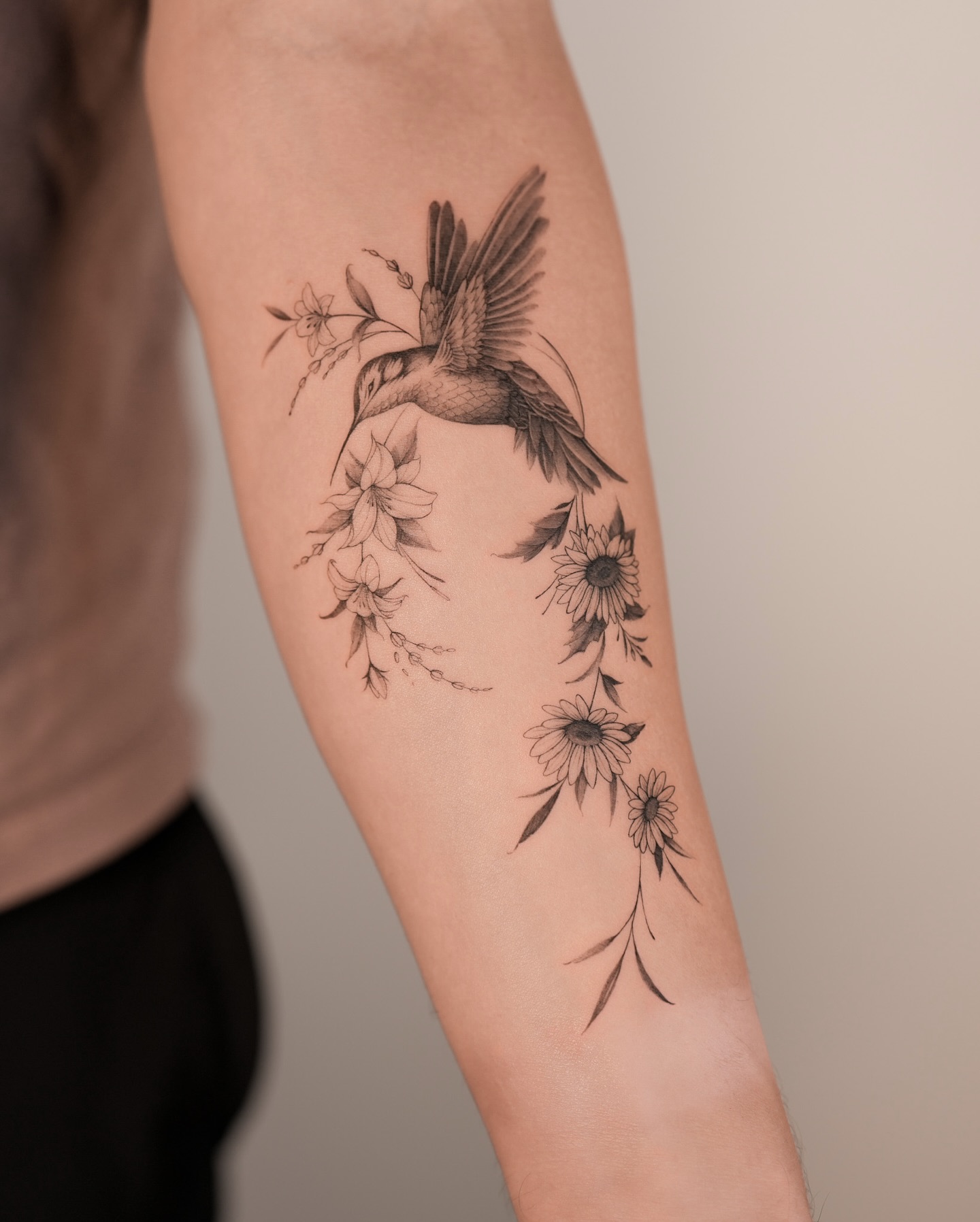 Floral Hummingbird Tattoo with Wildflowers hummingbird tattoos ideas tattoo