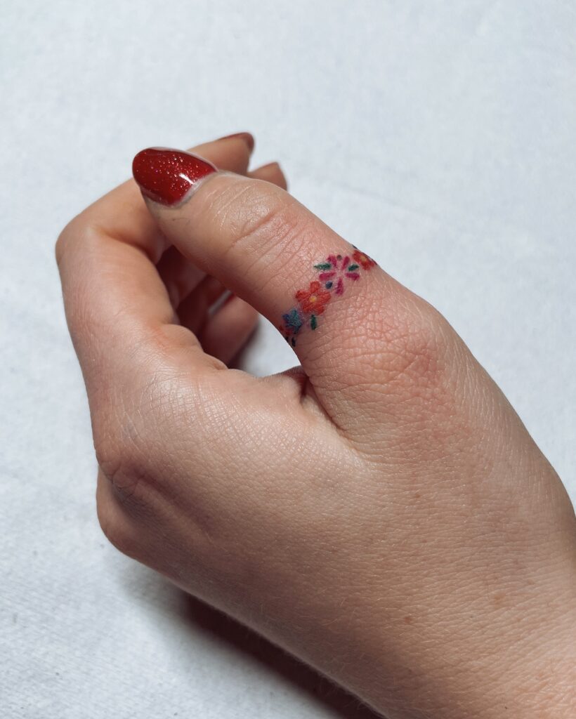 Floral Ring Finger Tattoo minimal tiny flower tattoo ideas tattoo