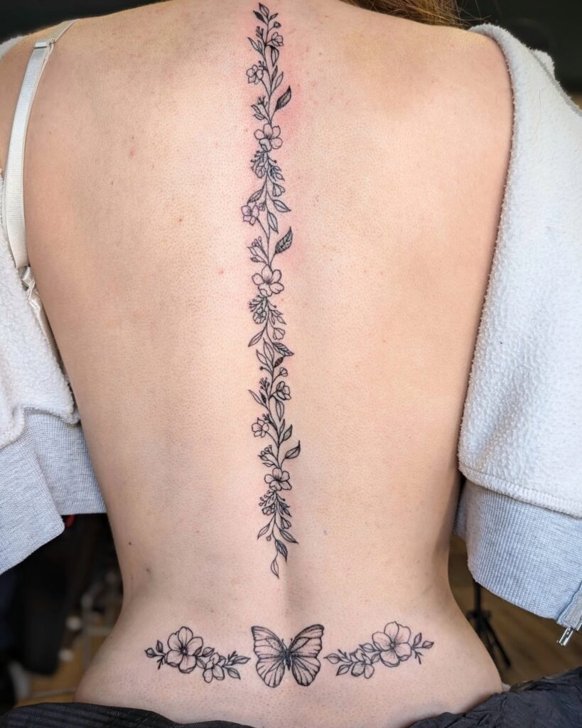 Ornamental Lotus Spine Tattoo