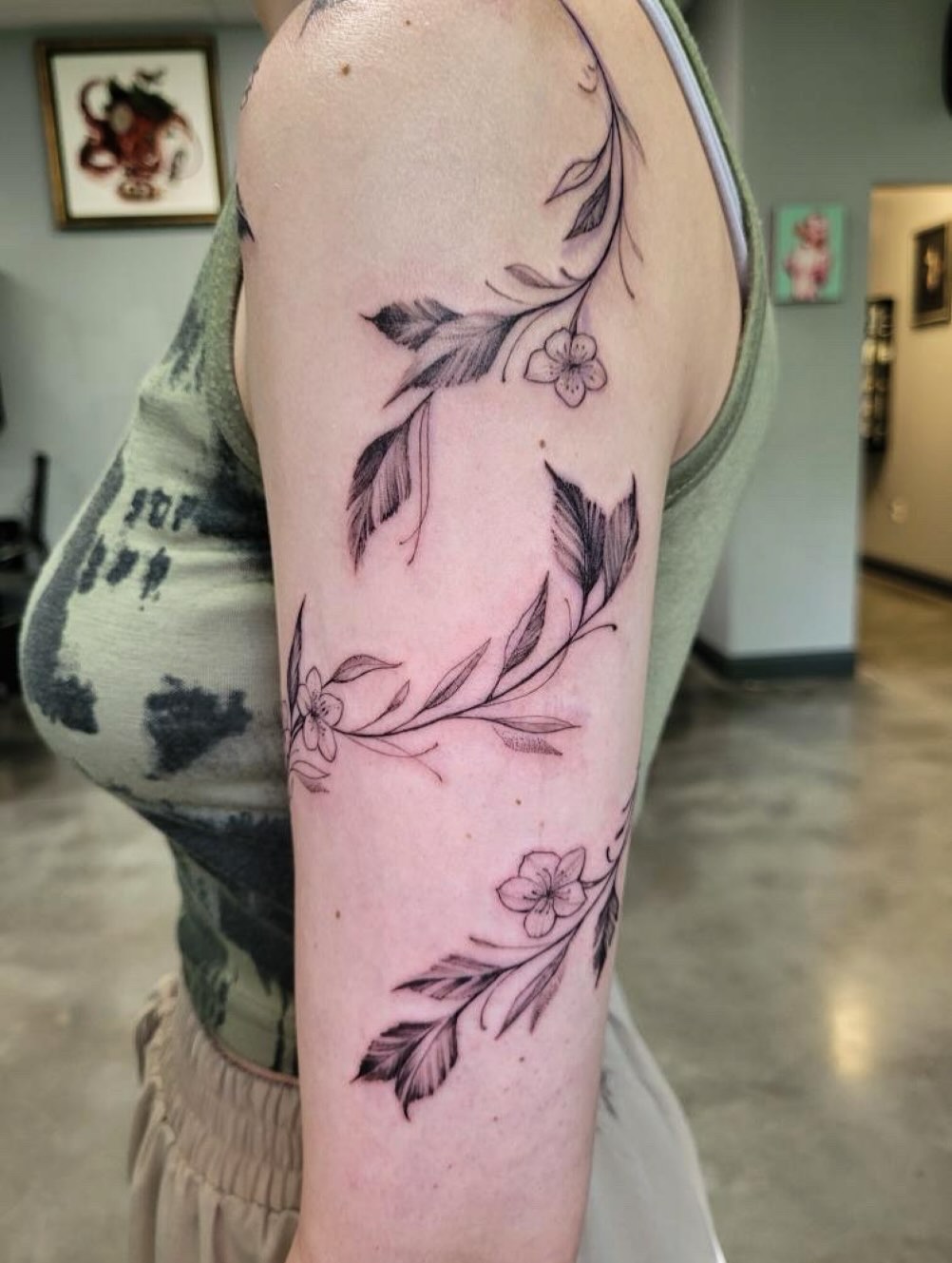 Flowing Lily Vine Tattoo on the Arm vine tattoos tattoo