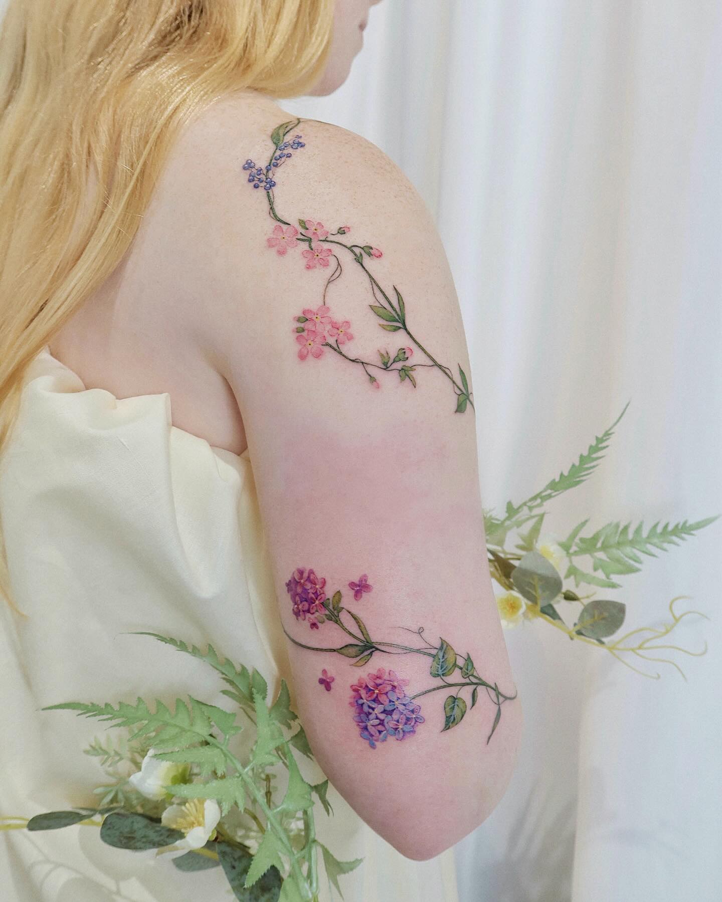 Graceful Vine Tattoo on Upper Arm vine tattoos tattoo