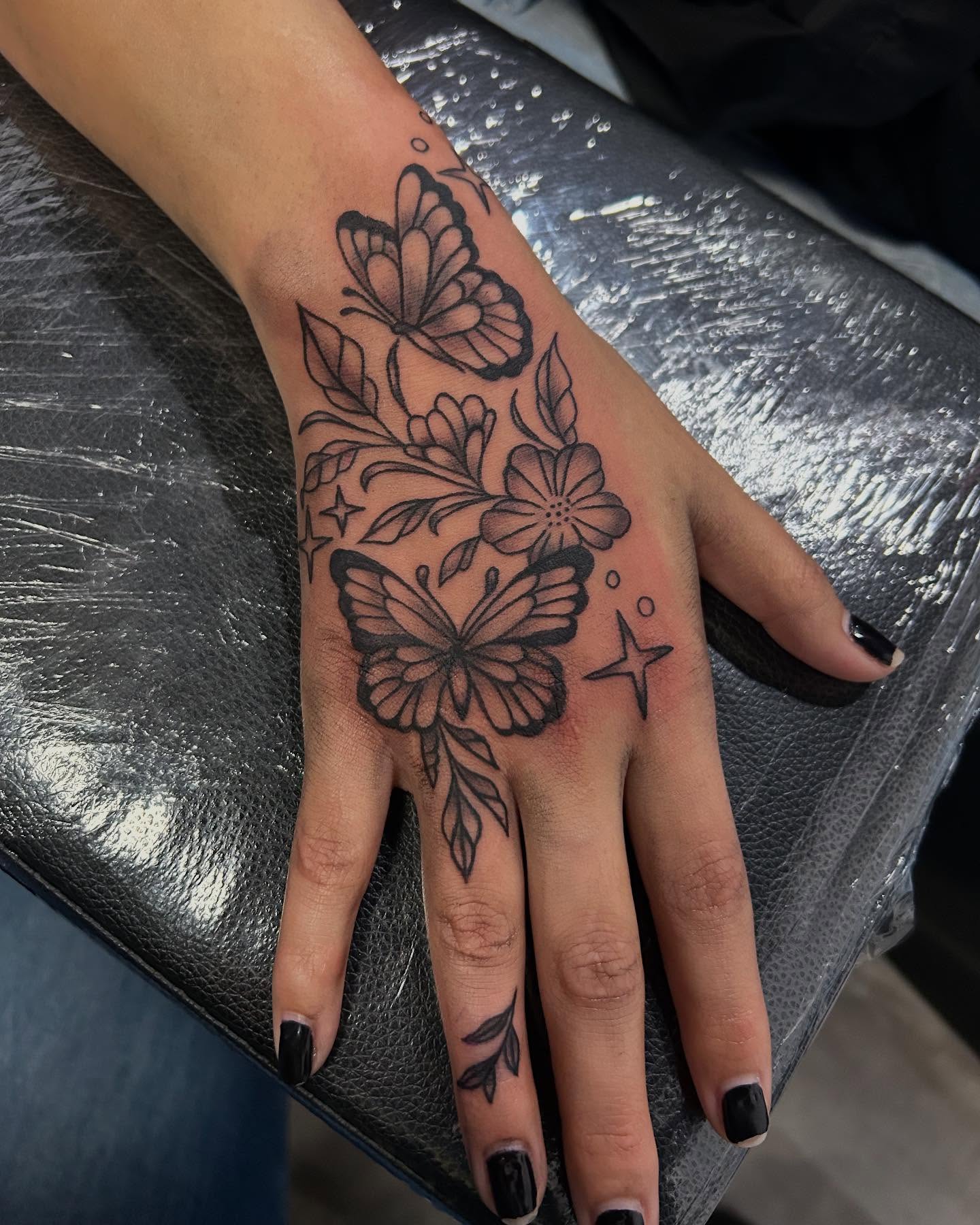 Large Moth And Floral Hand Tattoo