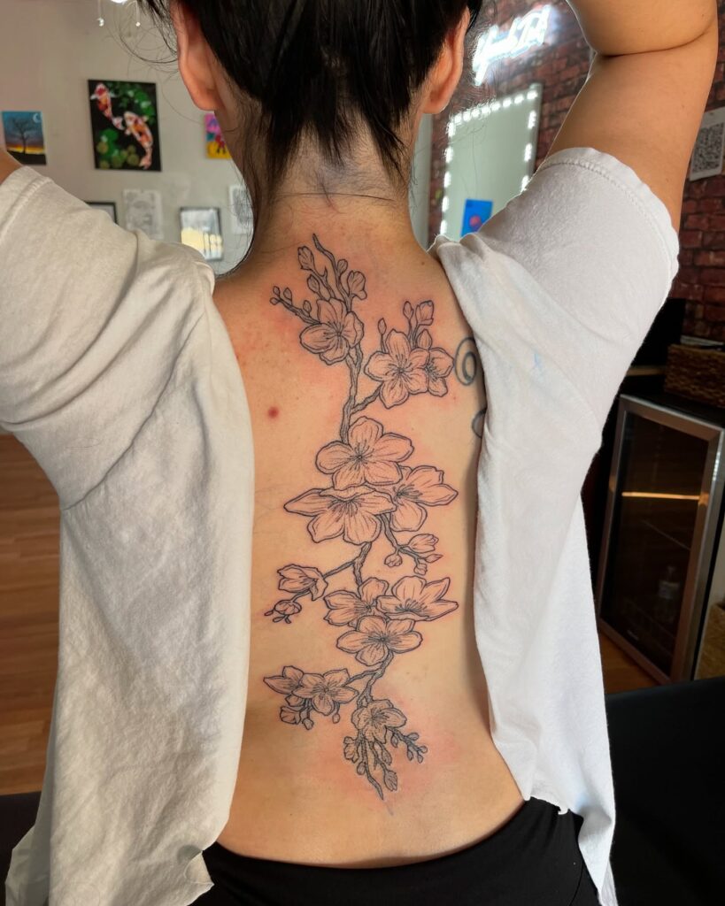 Blooming Floral Cascade Spine Tattoo