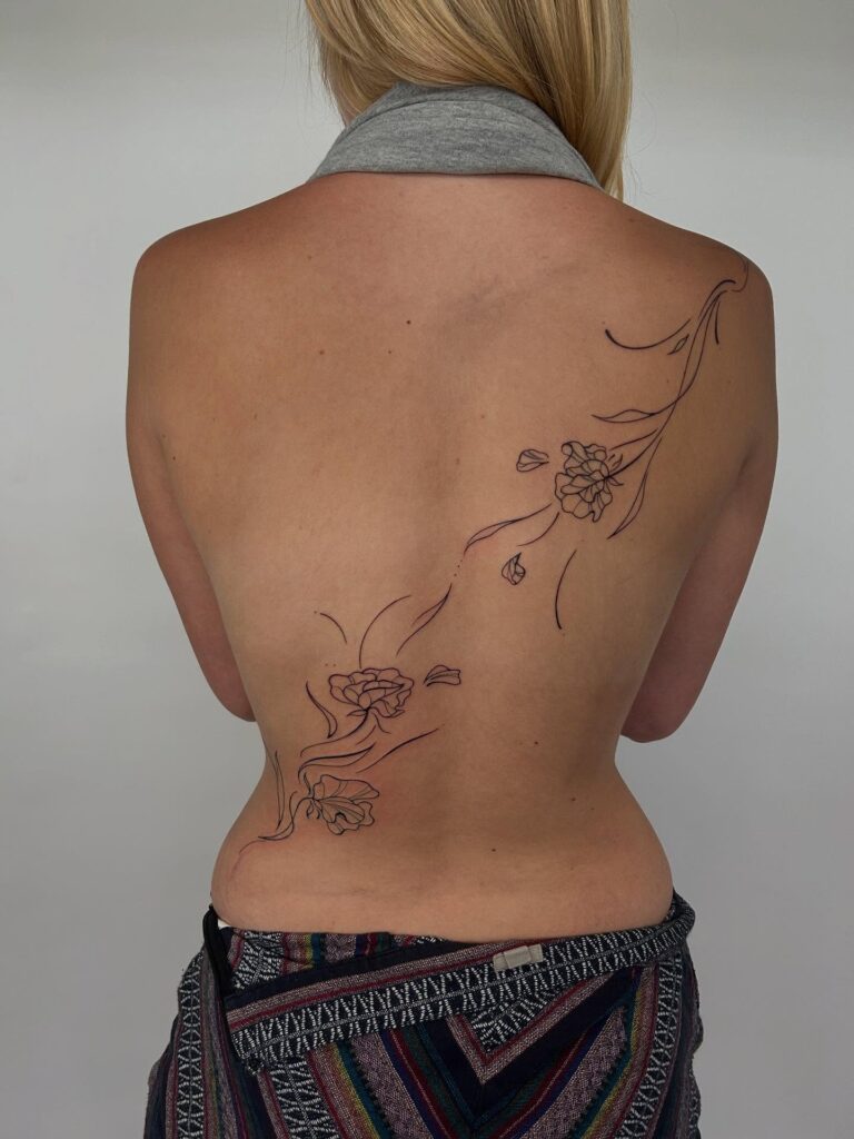 Ornamental Mandala Back Tattoo With Blackwork Accents