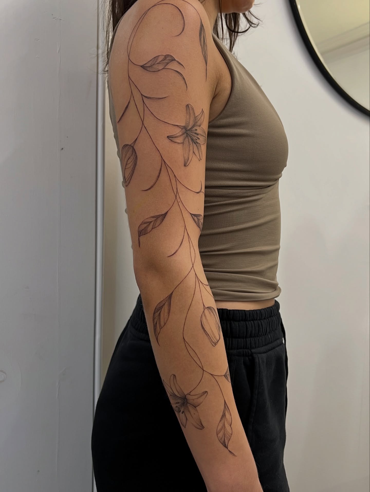 Floral Vine Tattoo on the Upper Arm vine tattoos tattoo