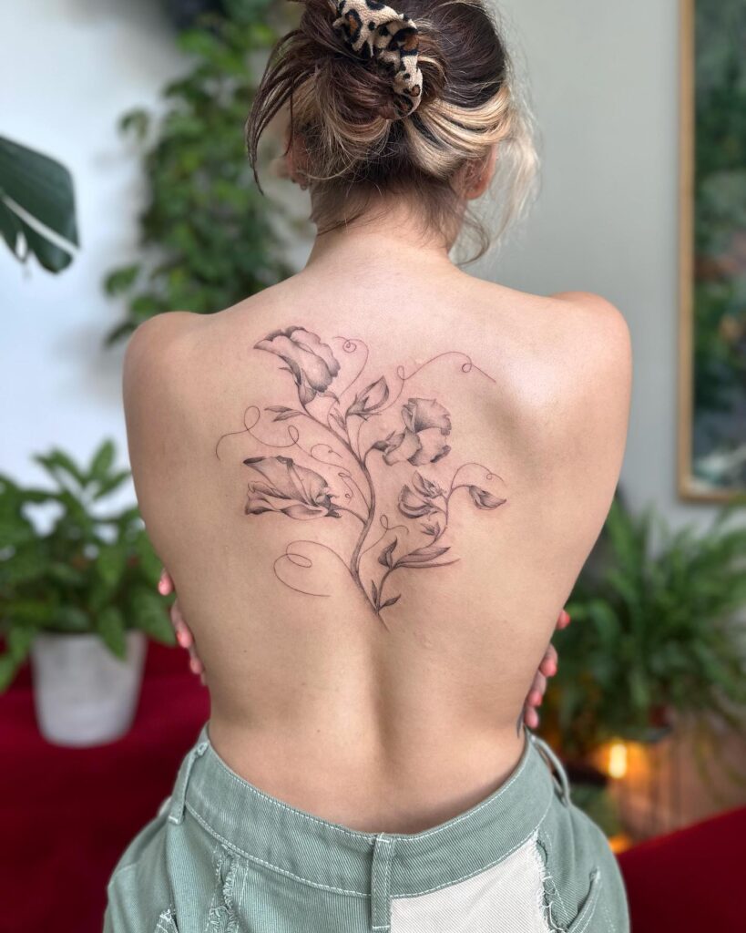 Flowing Sweet Pea Back Tattoo april birth flower tattoo ideas tattoo