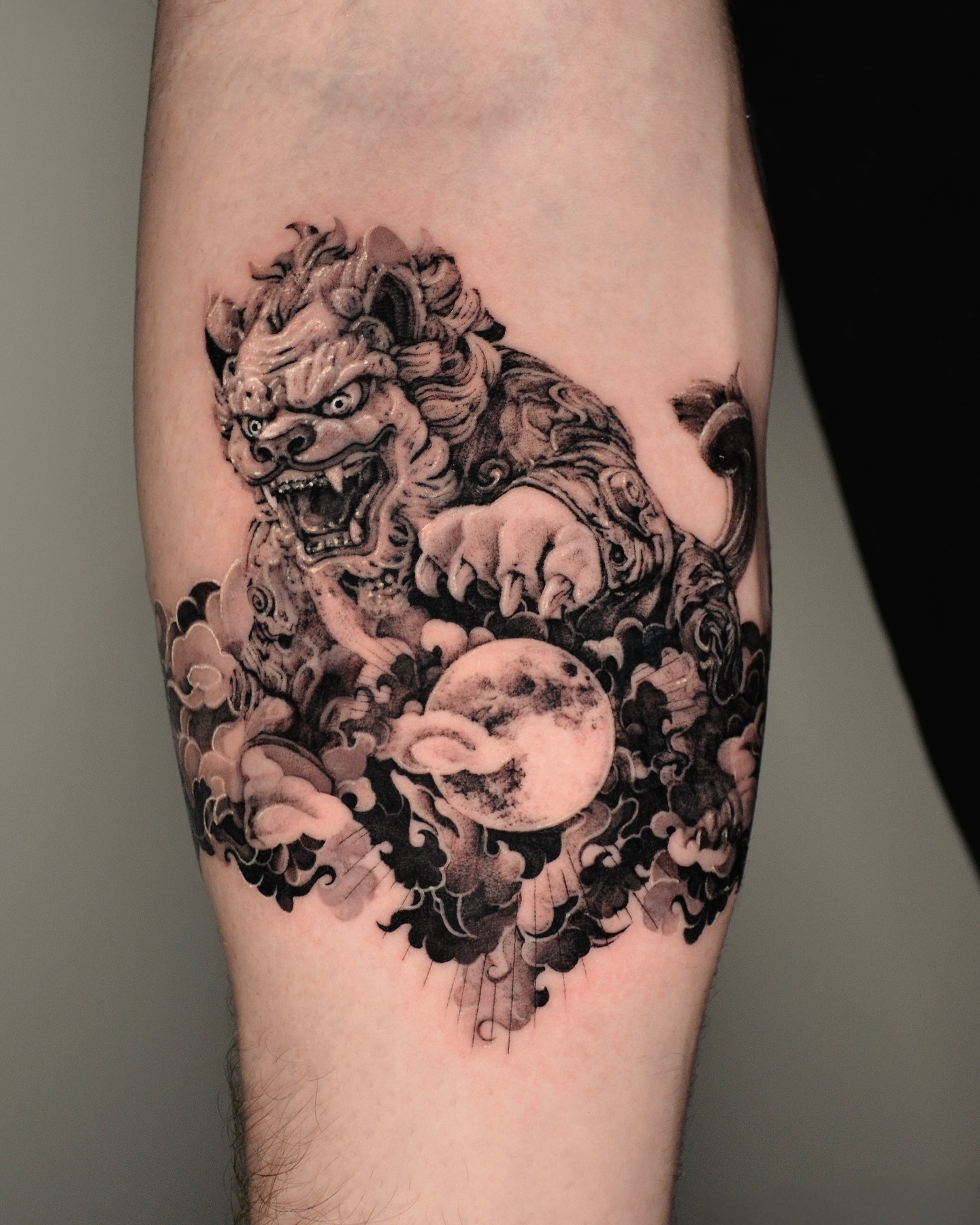 Foo Dog And Skull Forearm Tattoo