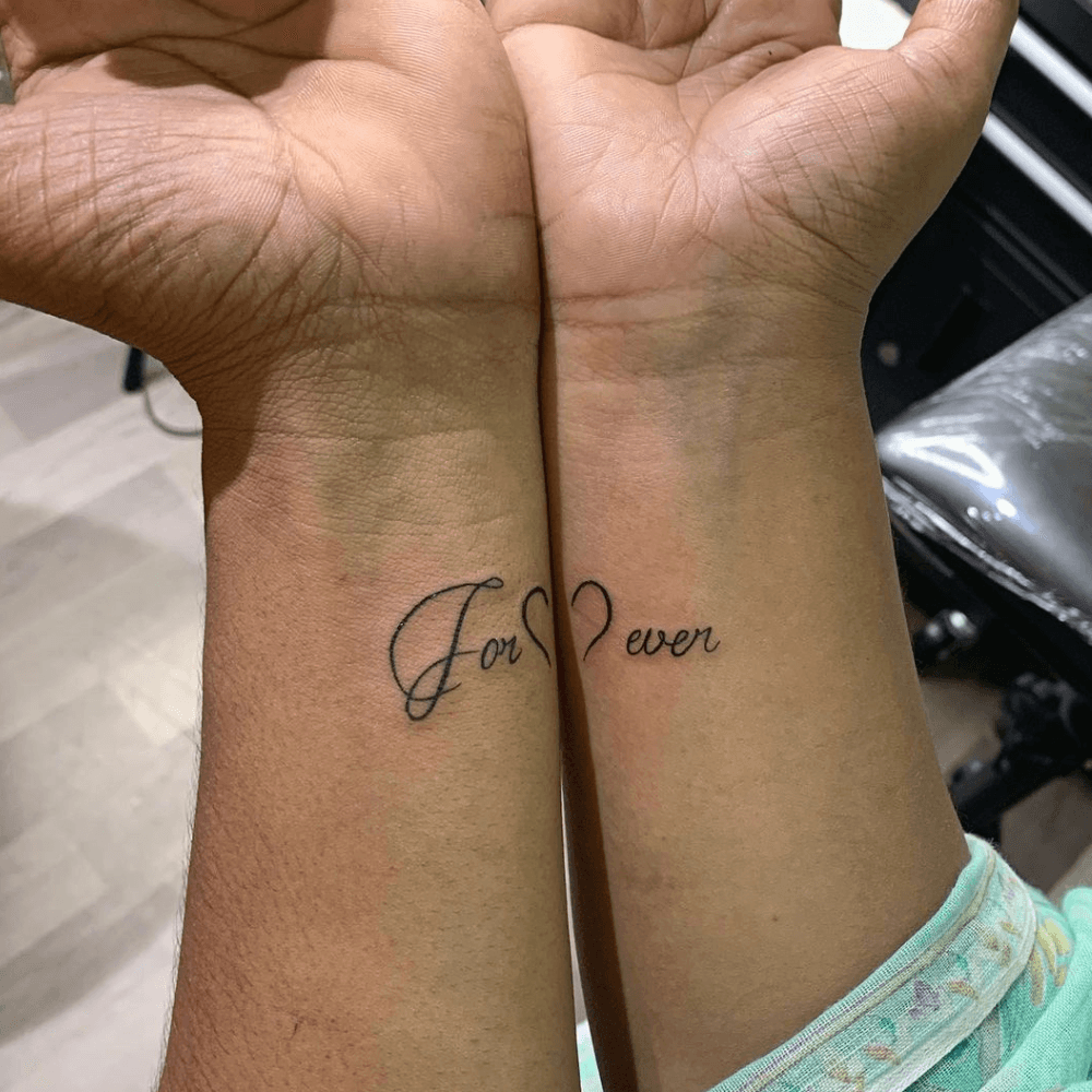 Forever Complimentary Forearm Tattoo