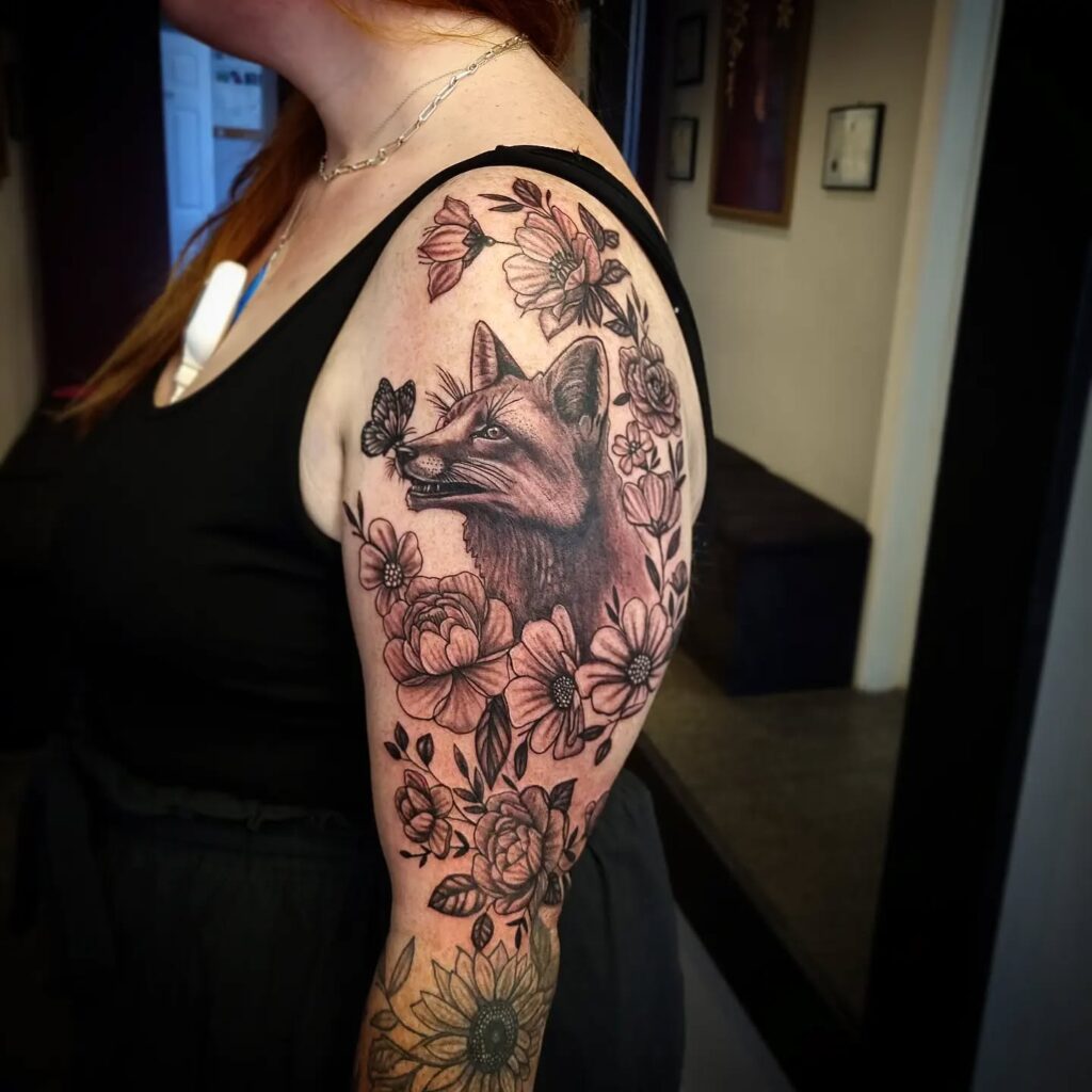 Bold Sun With Whimsical Face Upper Arm Tattoo