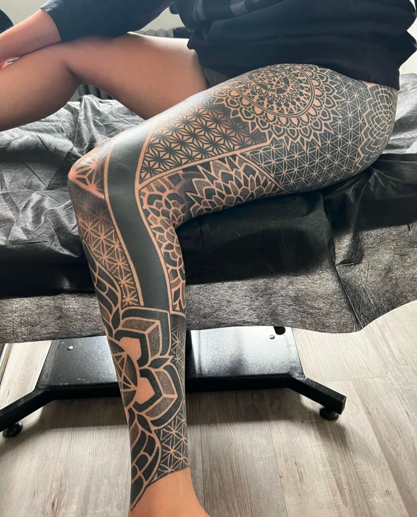 Lotus And Chakra Symbols Spine Tattoo