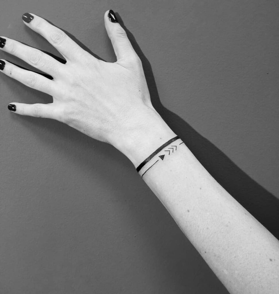 Layered Symbolic Bracelet Tattoo