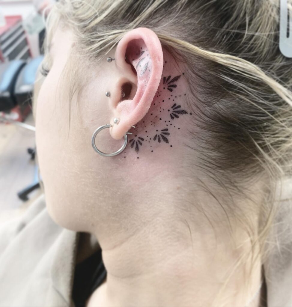 Minimal Lily Behind Ear Tattoo