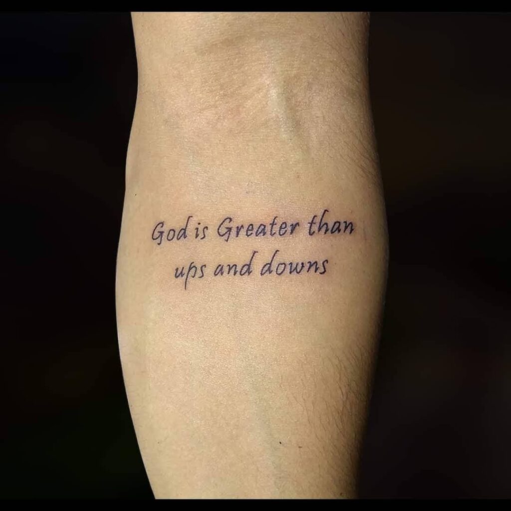 God Is Greater Than Ups and Downs &ndash; Faith and Resilience quote tattoo ideas for men tattoo
