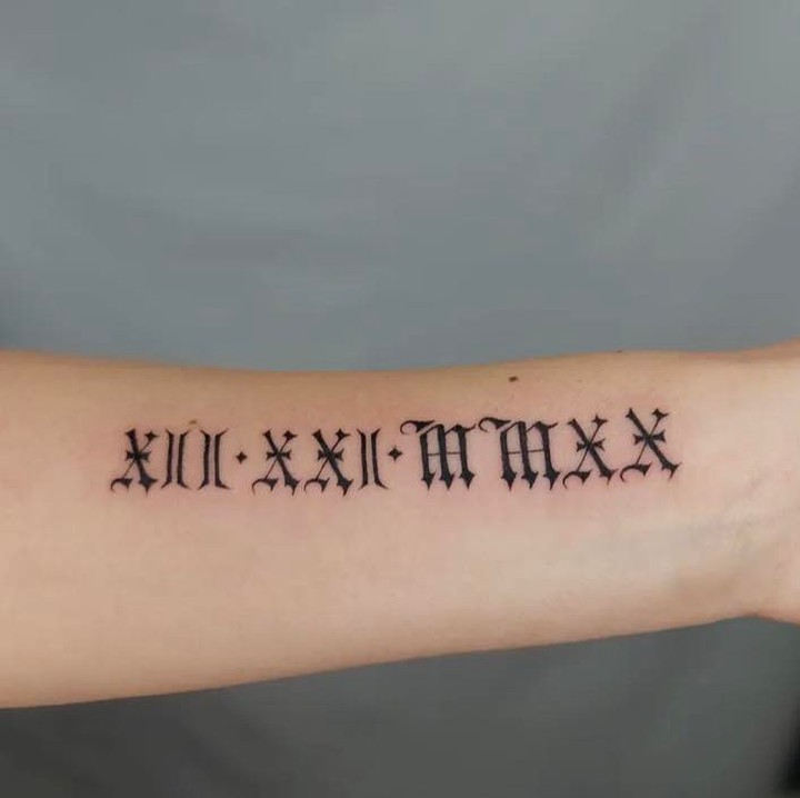 Mountain and Date Minimalist Tattoo roman numerals tattoos tattoo