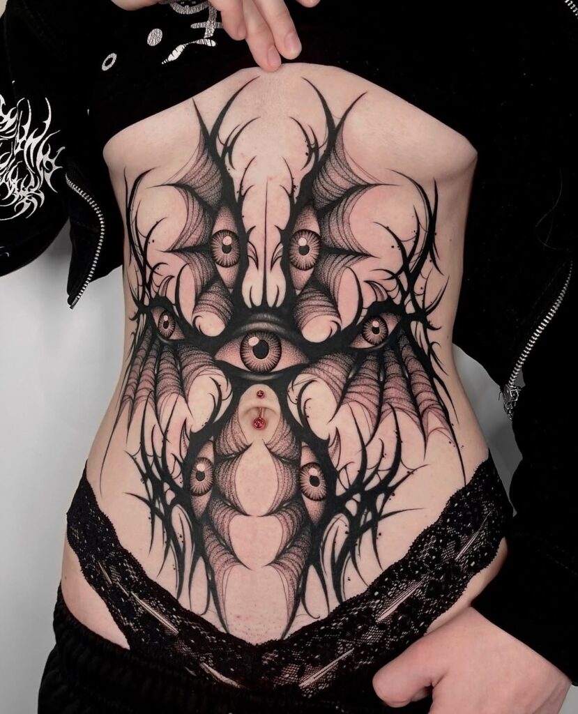 Gothic Seraphim Torso Tattoo with Piercing Eyes seraphim angel tattoo ideas tattoo
