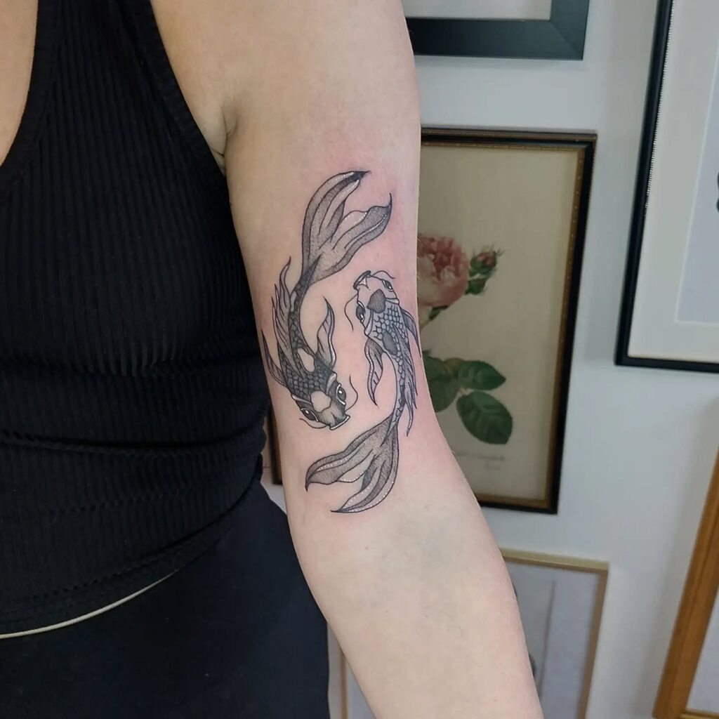 Snake, Sword, And Florals Upper Arm Tattoo