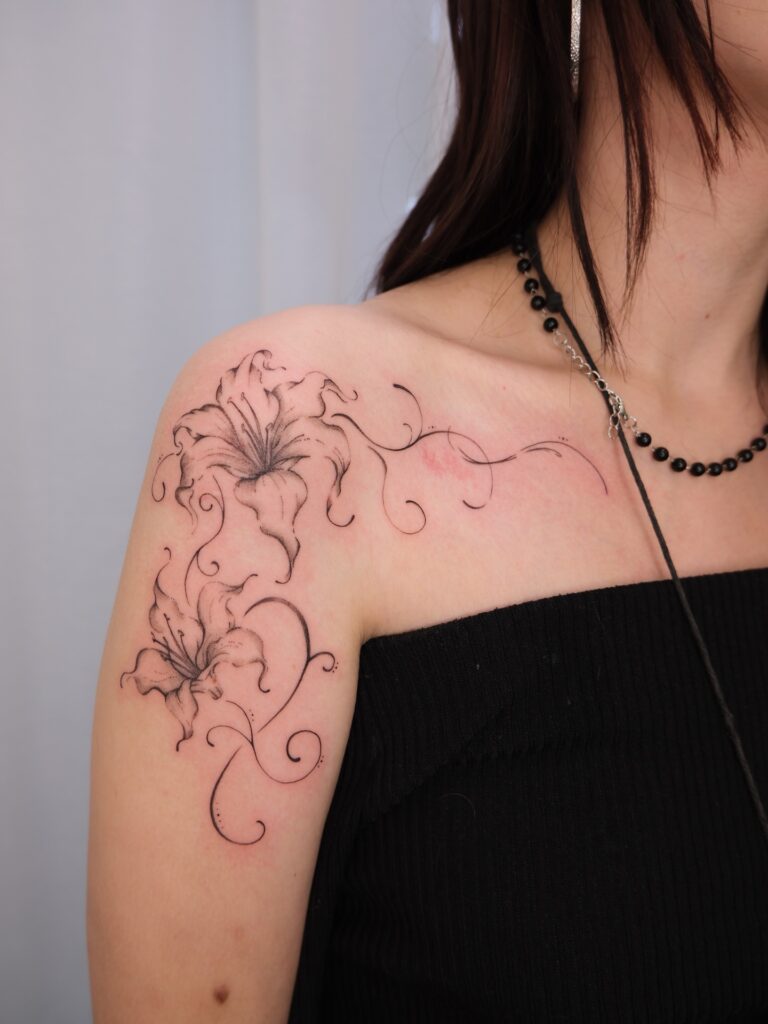 Graceful Lily Shoulder Tattoo fine line tattoos for women tattoo