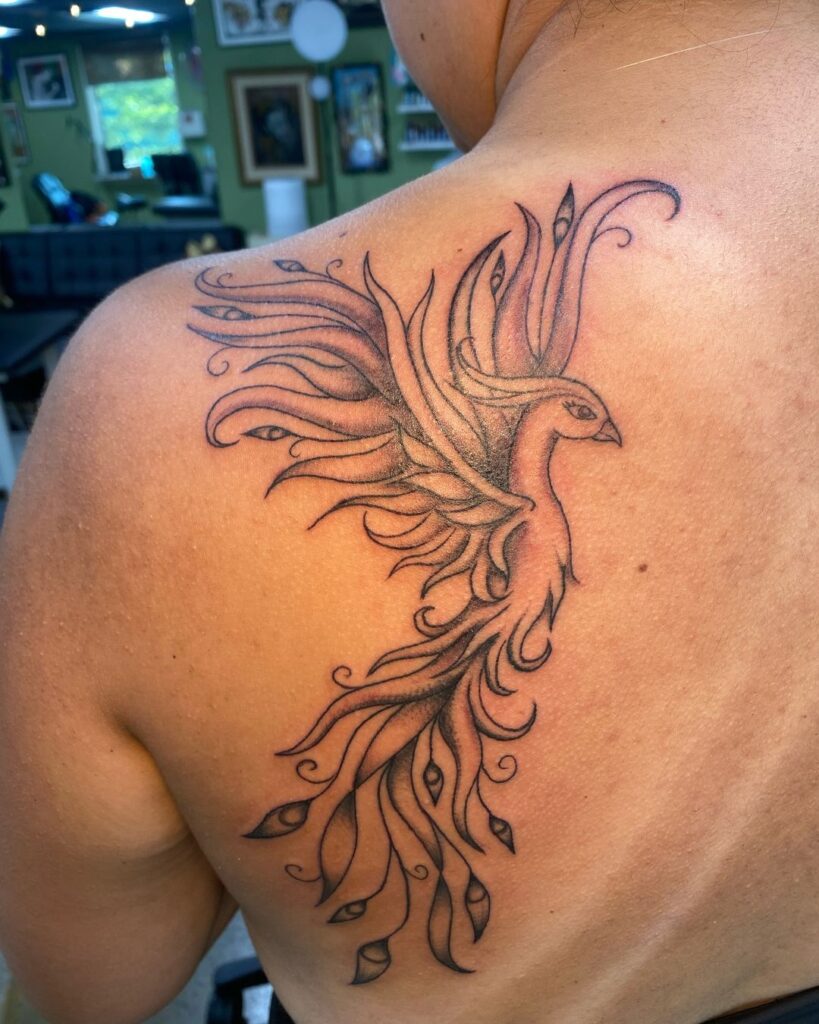 Graceful Phoenix in Flight meaningful tattoos to check out tattoo