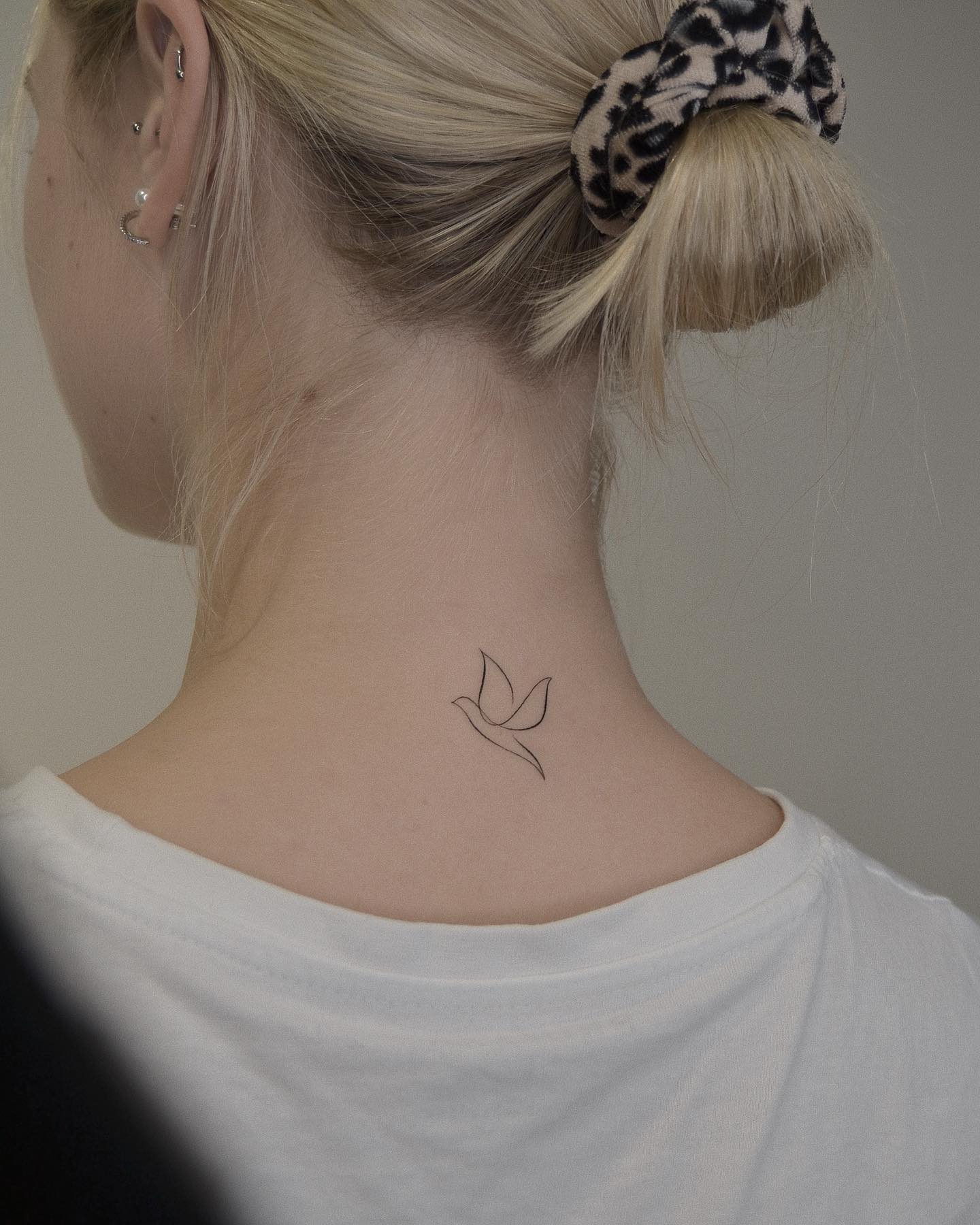 One line bird tattoo soaring with open wings