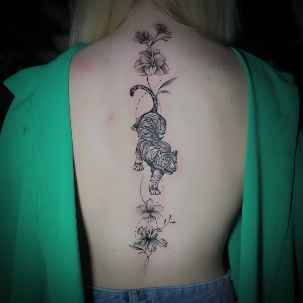 Elegant Floral Vine Spine Tattoo