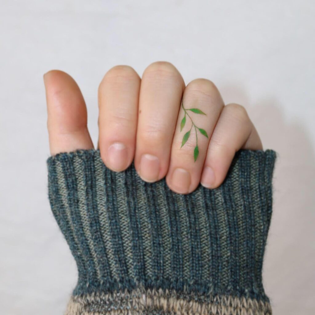 Colorful Tiny Flower Finger Tattoo