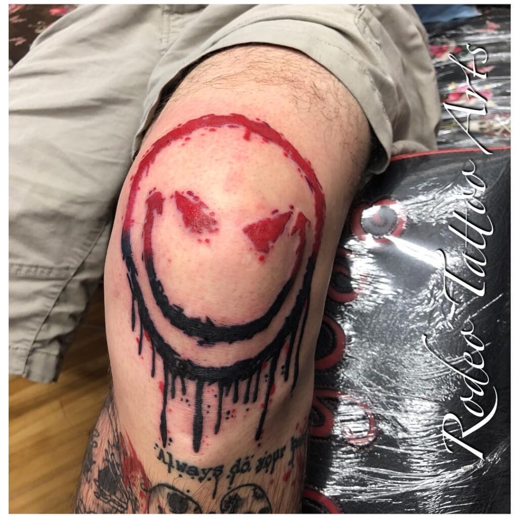 Grungy Smiley Knee Frame Tattoo