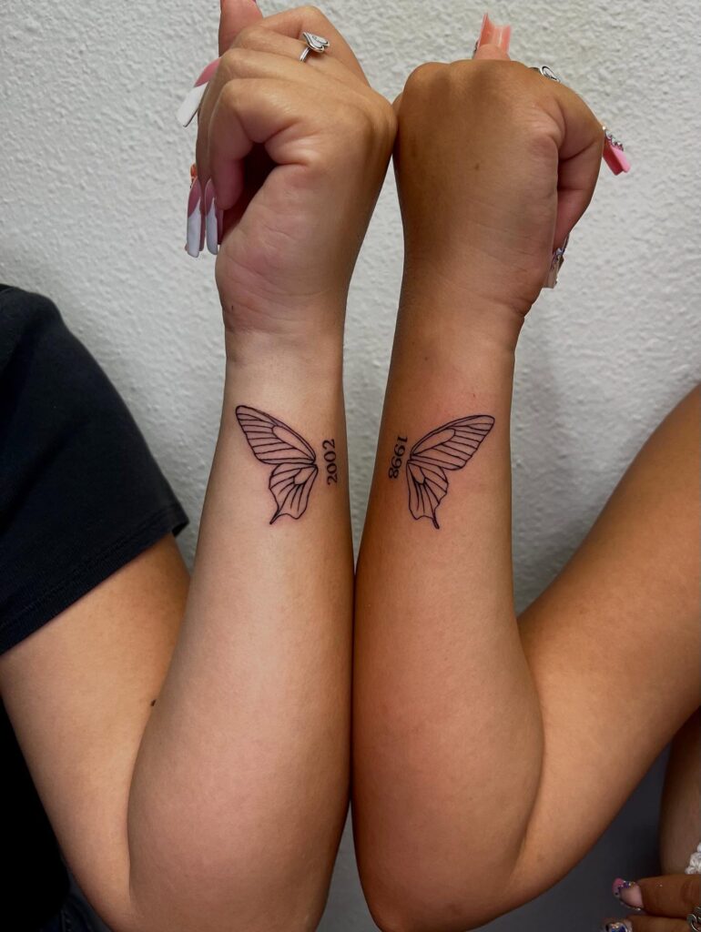 Half Butterfly Wing with Birth Year matching sibling tattoo