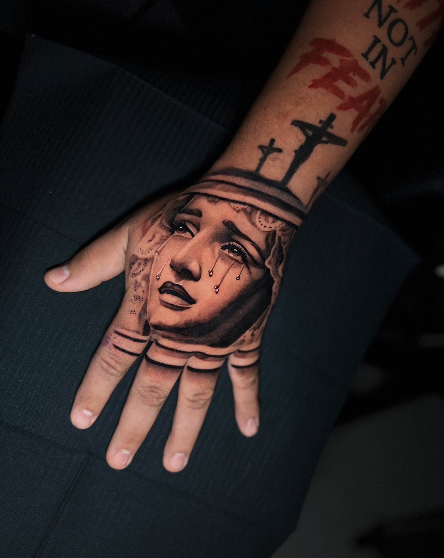 Crying Virgin Mary Hand Tattoo