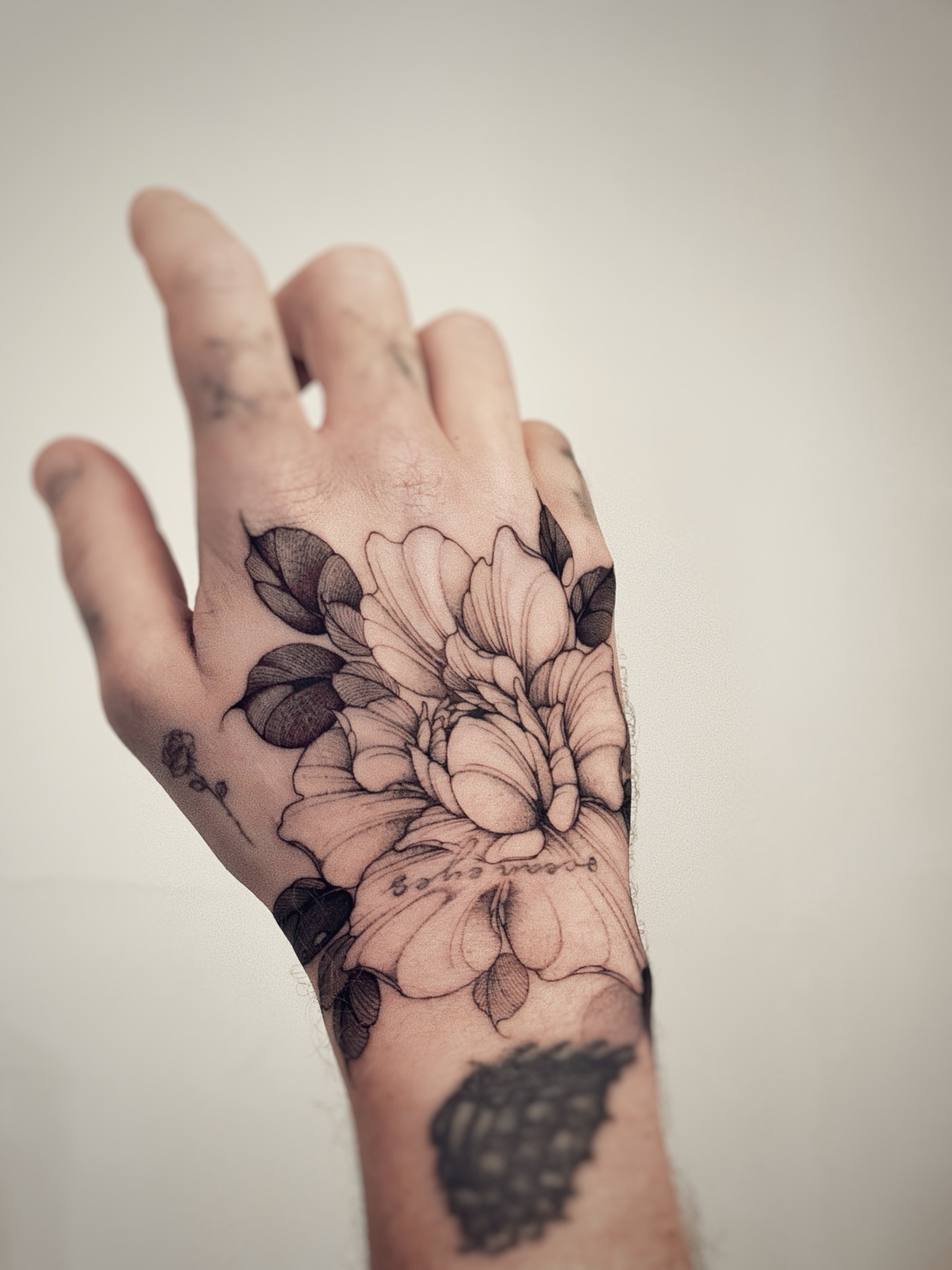 Peony Flower Hand Tattoo