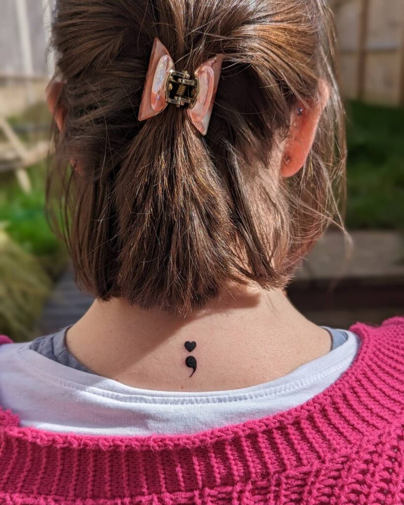 Heart and Semi-Colon Tattoo on the Neck meaningful semicolon tattoo ideas tattoo