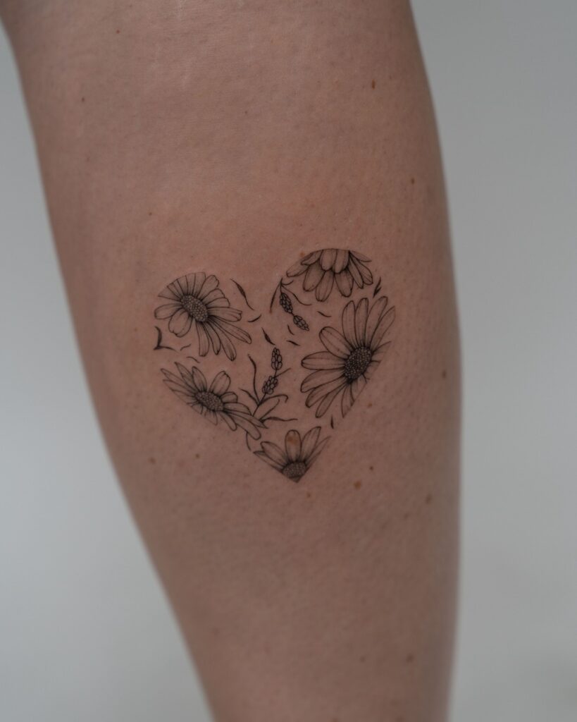 Heart-Shaped Daisy Tattoo april birth flower tattoo ideas tattoo