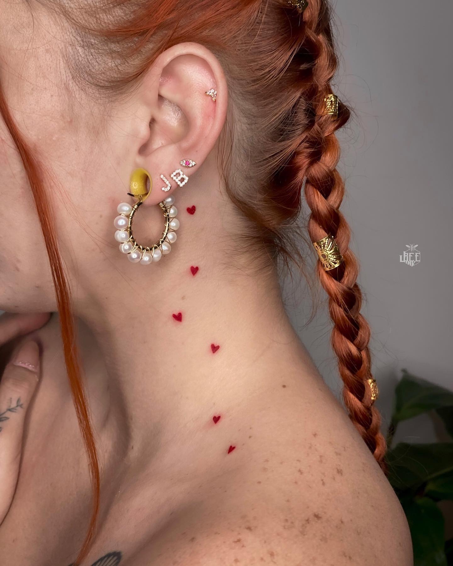 Tiny Red Heart Trail Tattoo