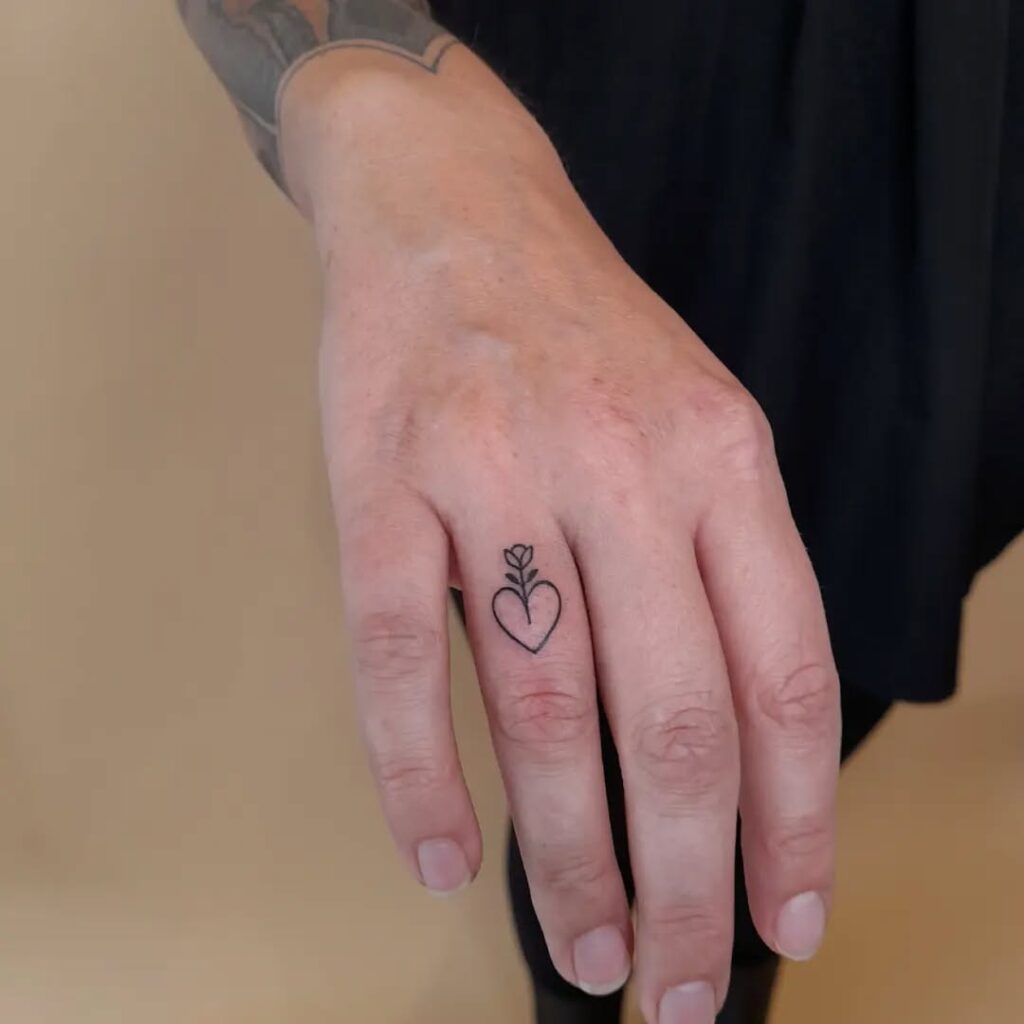 Tiny Rising Sun Finger Tattoo