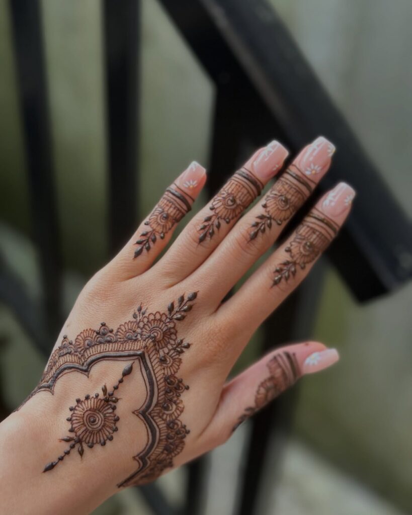 Trailing Botanical Vines Down the Spine henna tattoo