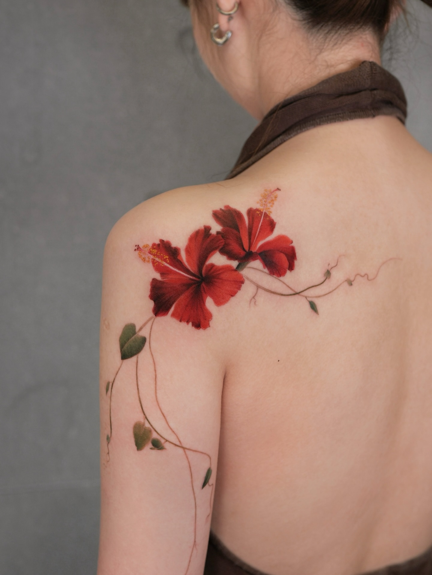 Colorful Floral Vine Tattoo Across Collarbone and Shoulder vine tattoos tattoo