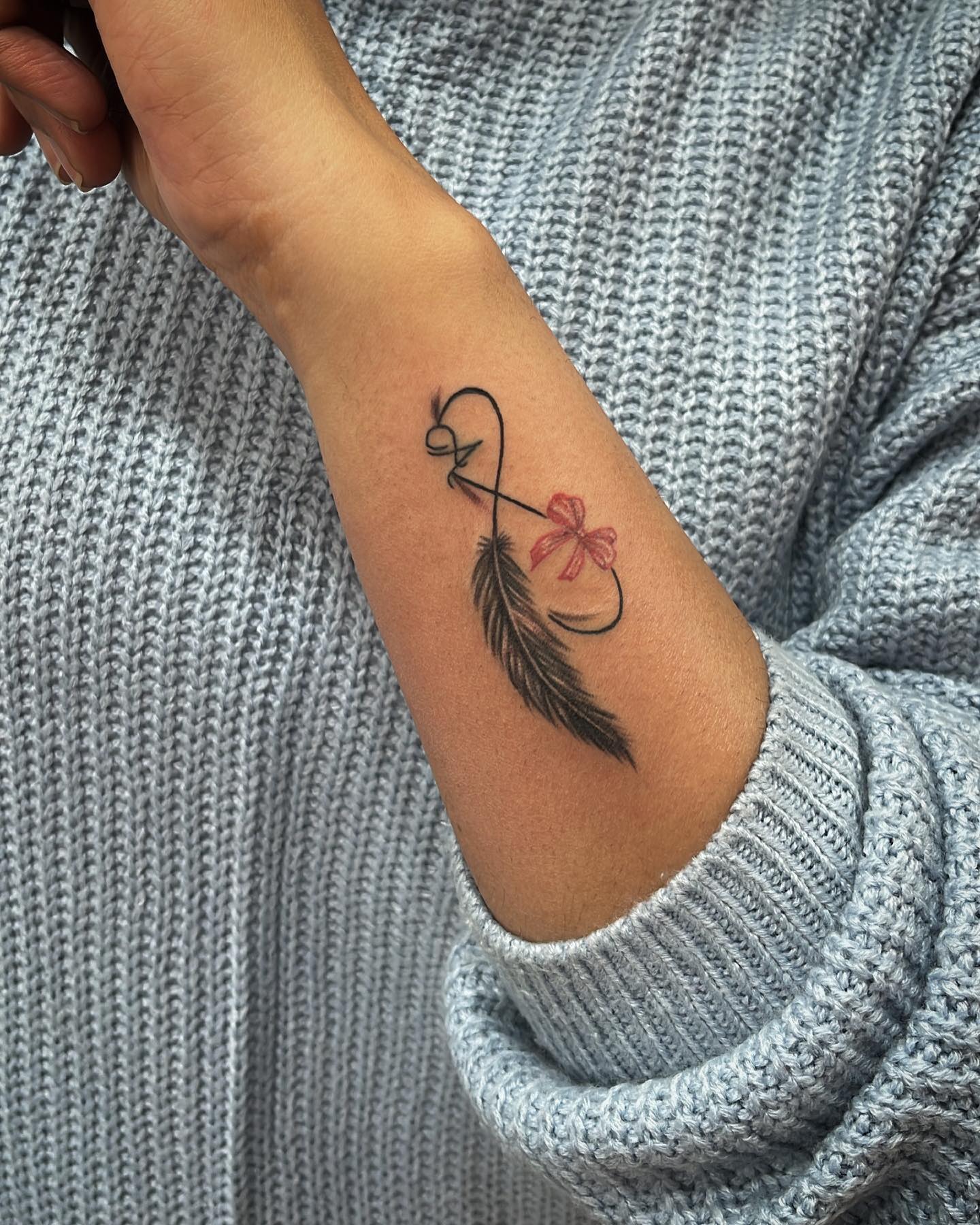 Blue Watercolor Feather Tattoo