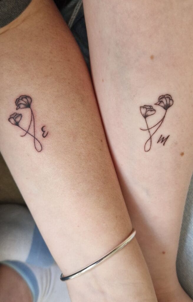 Initial Flower Mother-Daughter Tattoo mother and daughter tattoo ideas tattoo