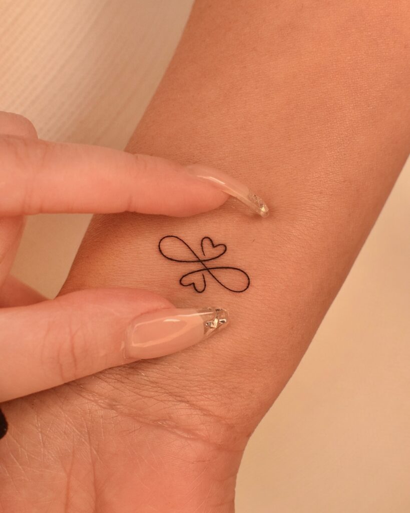 Intertwined Hearts Infinity Tattoo meaningful tiny tattoos tattoo