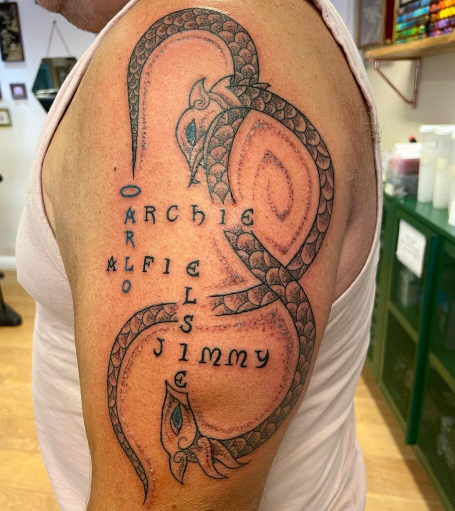 Intricate Dragon with Names grandchildren tattoos for grandparents tattoo