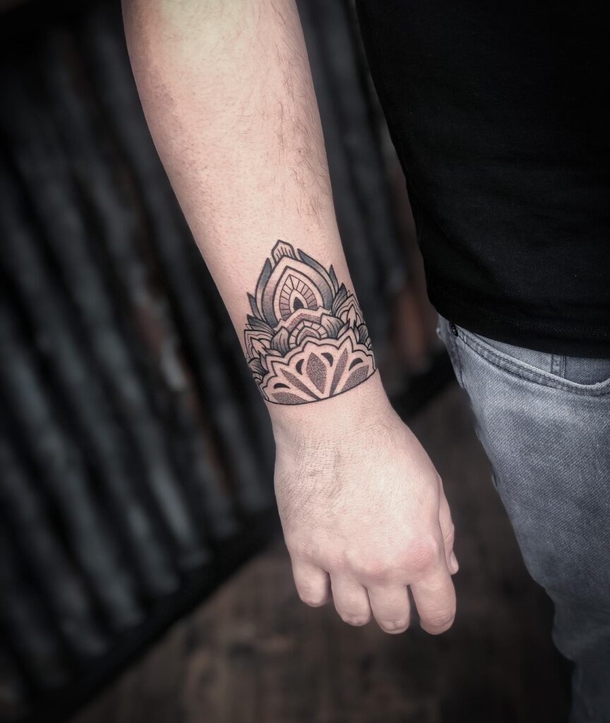 Intricate Mandala Wristband Tattoo mandala wrist tattoo ideas tattoo